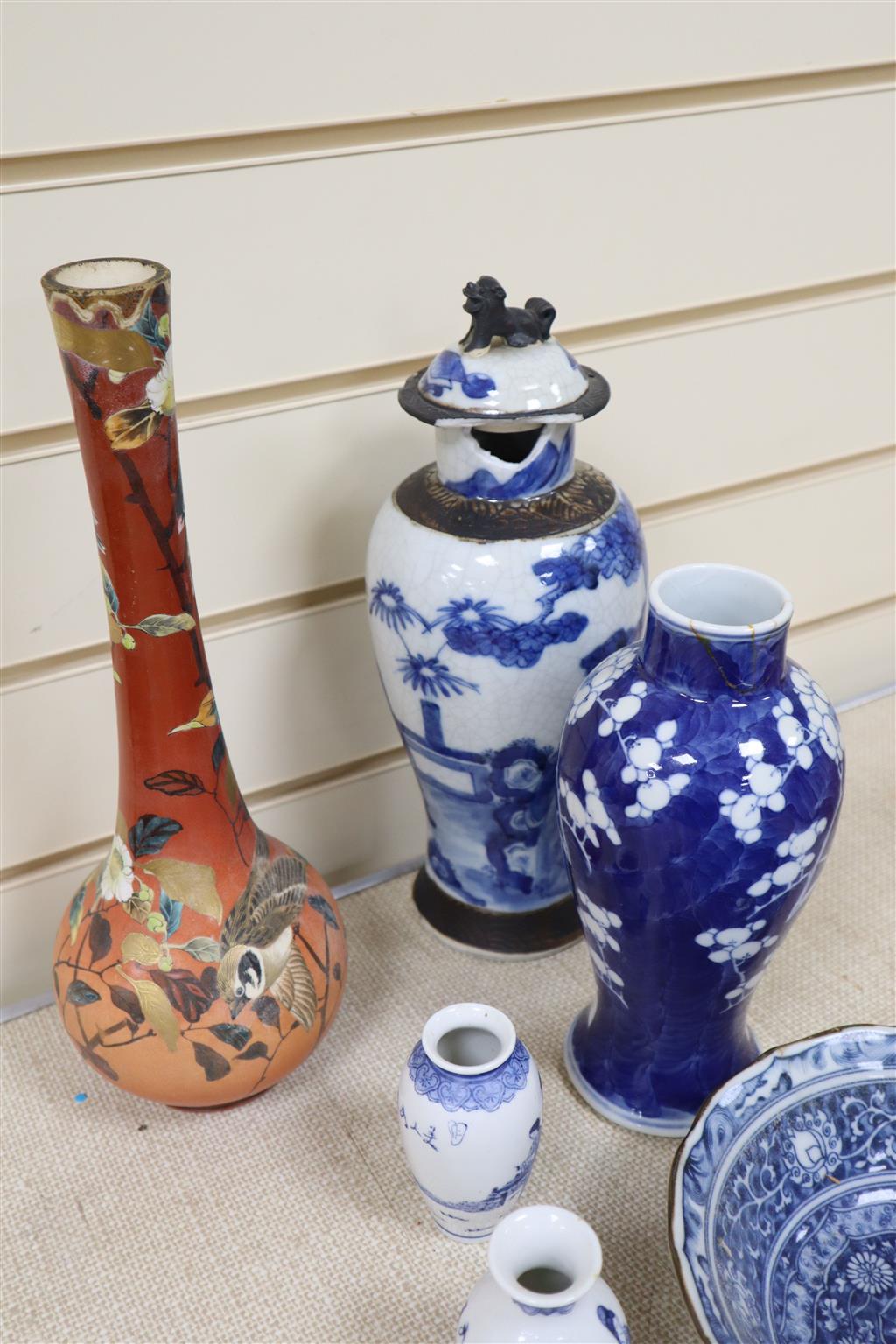 A graduated set of three Chinese porcelain blue and white bowls, largest 19cm and a group of four miniature Chinese blue and white vase